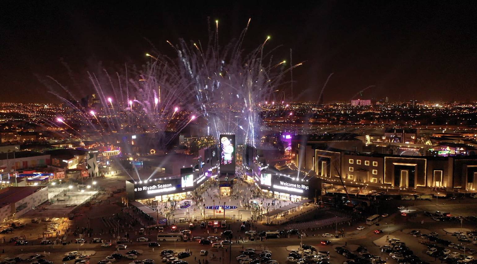 Fireworks in the sky above a city

Description automatically generated